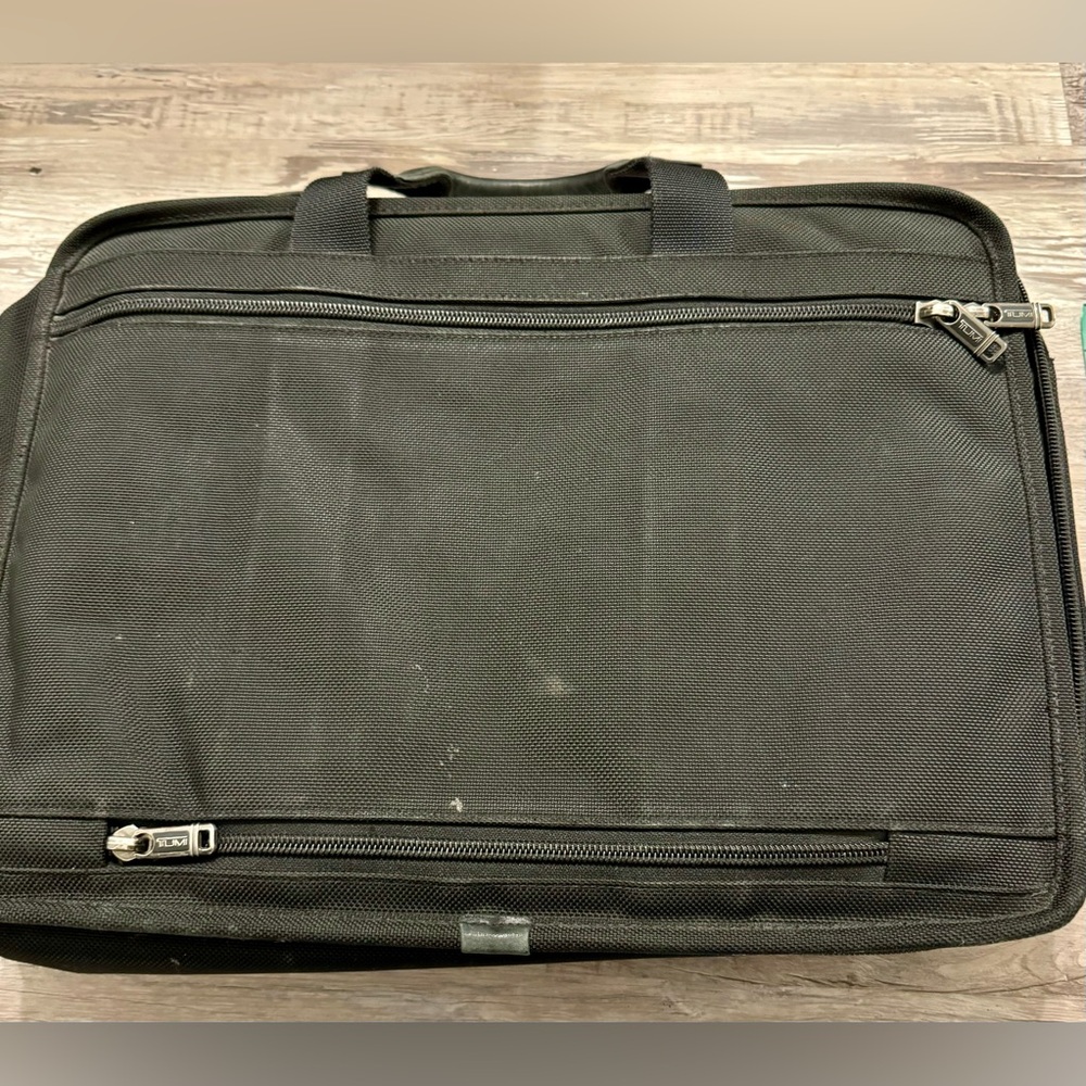 TUMI black laptop carrier bag. It has wallet inside.  It has various - Picture 10 of 15